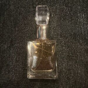 Juicy Couture Gold and Clear Body Oil Bottle